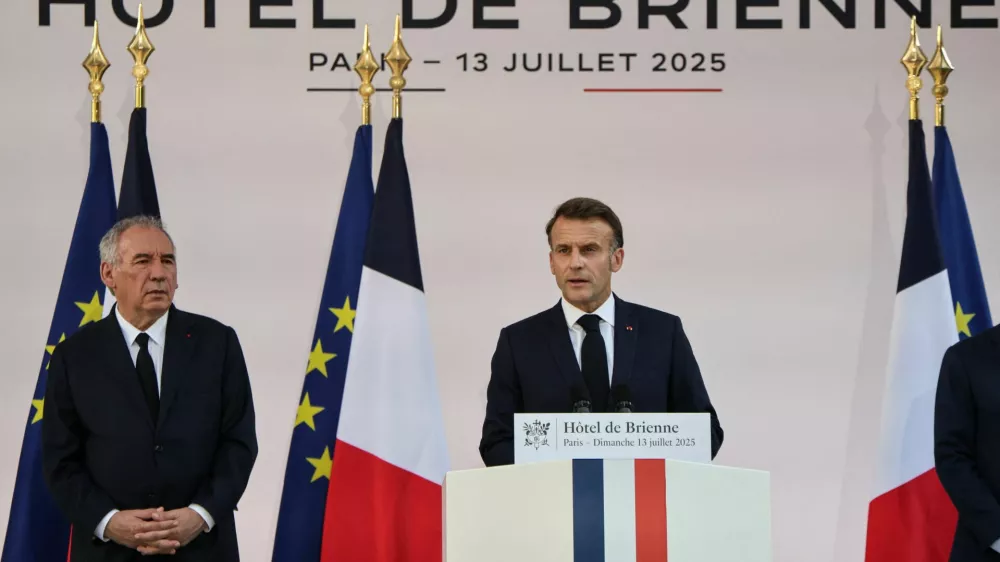 France Prime Minister Francois Bayrou listens as President of France Emmanuel Macron delivers a speech to army leaders, on the eve of the annual Bastille Day Parade in the French capital, at l'Hotel de Brienne in Paris, France July 13, 2025.   LUDOVIC MARIN/Pool via REUTERS