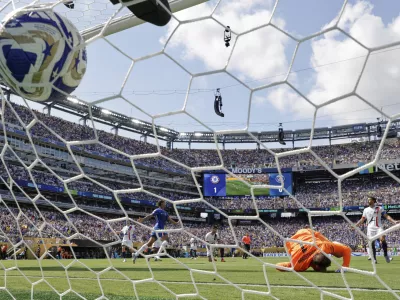 Paris Saint-Germain's goalkeeper Gianluigi Donnarumma can't make the save on the second goal scored by Chelsea's Cole Palmer during the Club World Cup final soccer match between Chelsea and PSG in East Rutherford, N.J., Sunday, July 13, 2025. (AP Photo/Adam Hunger)