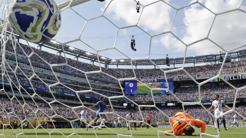 Paris Saint-Germain's goalkeeper Gianluigi Donnarumma can't make the save on the second goal scored by Chelsea's Cole Palmer during the Club World Cup final soccer match between Chelsea and PSG in East Rutherford, N.J., Sunday, July 13, 2025. (AP Photo/Adam Hunger)