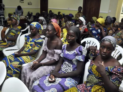 ﻿Chibok school girls recently freed from Boko Haram captivity are seen in Abuja, Nigeria, Sunday, May 7, 2017. The 82 freed Chibok schoolgirls arrived in Nigeria's capital on Sunday to meet President Muhammadu Buhari as anxious families awaited an official list of names and looked forward to reuniting three years after the mass abduction. (AP Photo/ Olamikan Gbemiga)