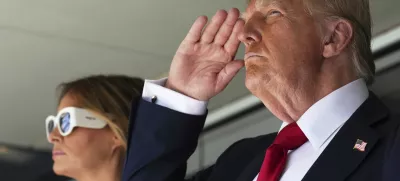 President Donald Trump, right, salutes alonside first lady Melania Trump as they attend the Club World Cup final soccer match, at MetLife Stadium in East Rutherford, N.J., Sunday, July 13, 2025. (AP Photo/Jacquelyn Martin)