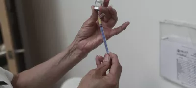 A health worker prepares a dose of the measles vaccine at the health center in Ciudad Juarez, Chihuahua state, Mexico, Wednesday, April 30, 2025. (AP Photo/Christian Chavez)