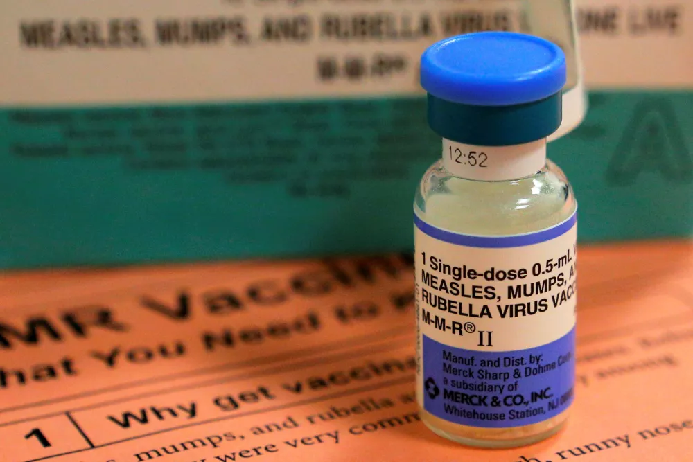 ﻿FILE PHOTO: A vial of measles, mumps and rubella vaccine and an information sheet is seen at Boston Children's Hospital in Boston, Massachusetts February 26, 2015.  REUTERS/Brian Snyder/File Photo