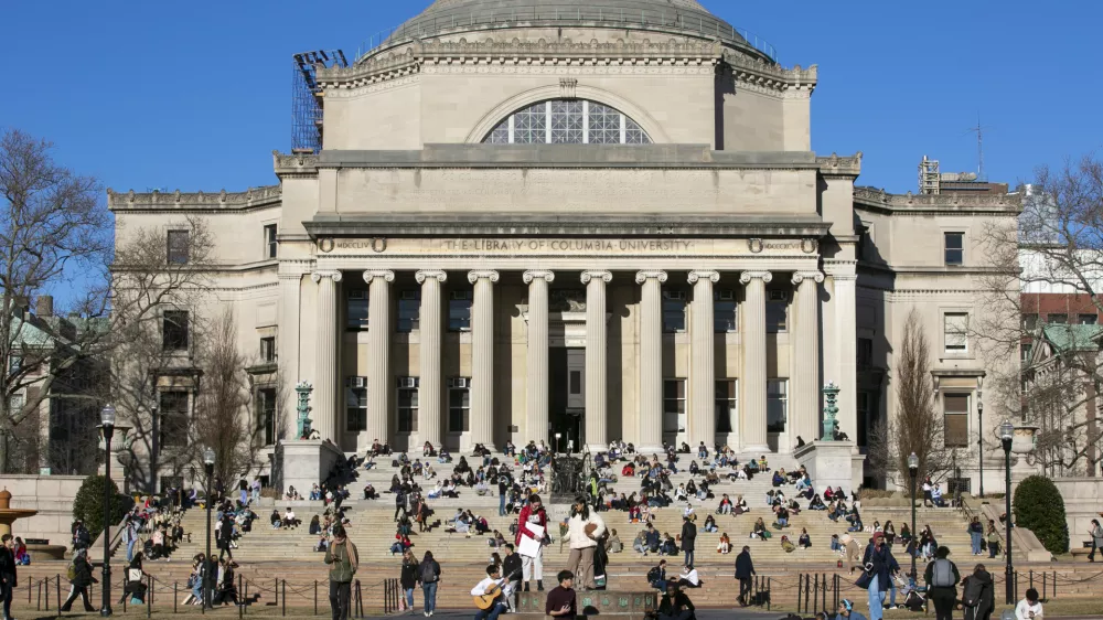 FILE - Students sit on the front steps of Low Memorial Library on the Columbia University campus in New York City, Feb. 10, 2023. (AP Photo/Ted Shaffrey, File)