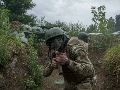 Ukrainian 3rd Assault Brigade recruits train at the polygon in Kyiv region, Ukraine, on Wednesday, July 16, 2025. (AP Photo/Evgeniy Maloletka)