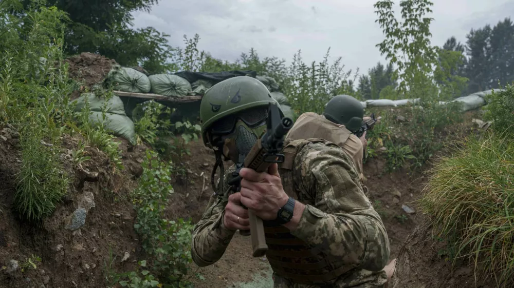 Ukrainian 3rd Assault Brigade recruits train at the polygon in Kyiv region, Ukraine, on Wednesday, July 16, 2025. (AP Photo/Evgeniy Maloletka)