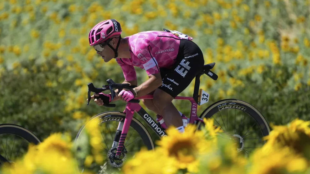 Italy's Vincenzo Albanese rides past a field of sunflowers during the eleventh stage of the Tour de France cycling race over 156.8 kilometers (97.4 miles) with start and finish in Toulouse, France, Wednesday, July 16, 2025. (AP Photo/Mosa'ab Elshamy)