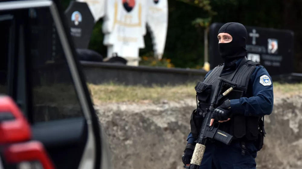 A police officer patrols in the aftermath of a shooting, on the road to Banjska village, Kosovo September 24, 2023. REUTERS/Laura Hasani