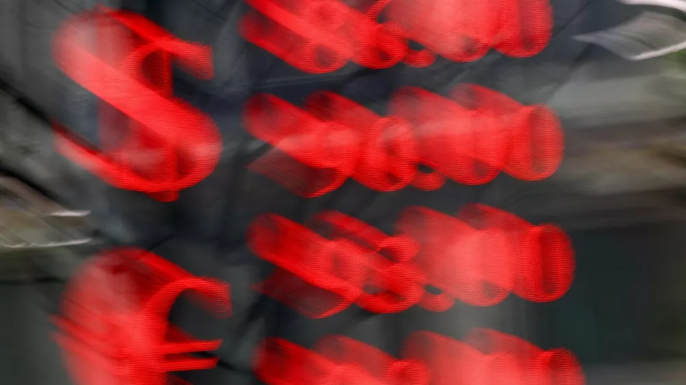 FILE PHOTO: An electronic board shows currency exchange rates of the U.S. dollar and euro against Russian rouble in a street in Moscow, Russia, March 20, 2025. REUTERS/Evgenia Novozhenina/File Photo