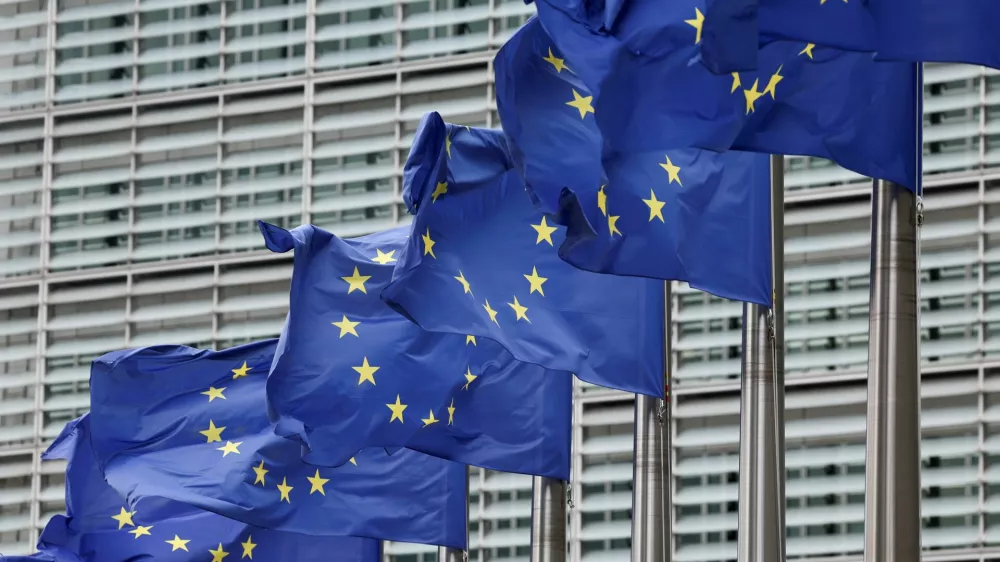 European Union flags flutter outside the EU Commission headquarters, on the day farmers protest against proposed cuts to Common Agricultural Policy (CAP) funding and the European Commission's plan to merge agricultural and cohesion policies, in Brussels, Belgium July 16, 2025. REUTERS/Yves Herman