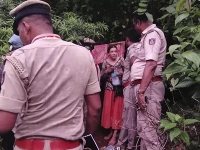 Indian policemen rescue Nina Kutina, 40, a Russian woman, from a cave in forest area of Ramtirtha hills in southern Indian state of Karnataka, Wednesday, July 9, 2025. (Uttara Kannada District Police via AP)