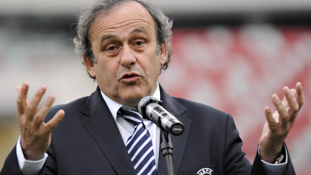 FILE - In this April 12, 2012 UEFA President Michel Platini speaks to journalists during a press conference at the National Stadium in Warsaw. The 2020 European Championship could be hosted by 12 or 13 cities across Europe in a potentially radical change to the world's second biggest football tournament, UEFA President Michel Platini said on Saturday, June 30, 2012. Held every four years, the European Championship is second only to the World Cup in global popularity and until 12 years ago was staged in one nation. (AP Photo/Alik Keplicz, File)
