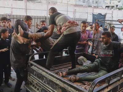 Palestinians who were injured during a food distribution at a center run by the Gaza Humanitarian Foundation, a U.S.-backed organization approved by Israel, are brought to Nasser Hospital in Khan Younis, southern Gaza Strip, Saturday, July 19, 2025. (AP Photo/Mariam Dagga)
