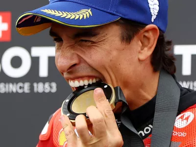 MotoGP - German Grand Prix - Sachsenring, Hohenstein-Ernstthal, Germany - July 12, 2025 Ducati Lenovo Team's Marc Marquez celebrates with his medal after winning the sprint race REUTERS/Lisi Niesner   TPX IMAGES OF THE DAY