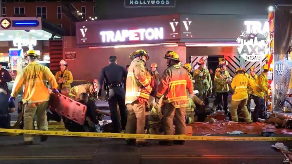 Members of emergency services work at the scene after a vehicle plunged into a crowd outside a nightclub, on Santa Monica Boulevard in the East Hollywood of Los Angeles, California, U.S., July 19, 2025, in this screen grab obtained from social media. AXN NEWS/via REUTERS THIS IMAGE HAS BEEN SUPPLIED BY A THIRD PARTY. MANDATORY CREDIT. NO RESALES. NO ARCHIVES. MUST NOT OBSCURE LOGO.