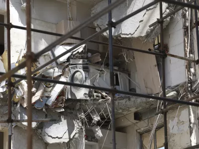 Damage from a deadly June 13 Israeli airstrike is seen on a building at a residential compound in Tehran, Iran, on Saturday, July 19, 2025. (AP Photo)