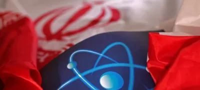 FILE PHOTO: Atomic symbol and Iranian flag are seen in this illustration taken September 8, 2022. REUTERS/Dado Ruvic/Illustration/File Photo