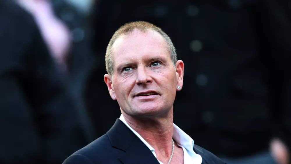 ﻿FILE - In this Sunday, Oct. 16, 2011 file photo, Paul Gascoigne, is seen in the stands ahead of the English Premier League soccer match between Newcastle United and Tottenham Hotspurs at St James' Park, Newcastle, England. Paul Gascoigne's appearance at a charity event, with his hands shaking uncontrollably and a stream of swear words tumbling out of his mouth, has sparked renewed fears about the health of one of England's most talented and popular footballers, with some are even saying his life is in danger. Gordon Taylor, chief executive of the Professional Footballer's Association, said Monday, Feb. 4, 2013, that "he sounds as if he needs almost a 24-hour watching brief at the moment." (AP Photo/Scott Heppell, File)