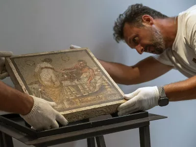 An erotic Ancient Roman mosaic stolen by a Wehrmacht officer in 1944 and given to a German citizen was returned to its rightful home at Pompeii, Italy in a ceremony by Italy's crack art cops on July 15, 2025. The German army captain, responsible for the military supply chain in Italy during World War II, handed over the mosaic of a pair of lovers in an erotic scene to a German citizen whose family have now returned it thanks to the Carabinieri of the Cultural Heritage Protection Unit (TPC) of Rome. The work of great cultural interest dates between the mid-last century BC and the 1st century AD. Repatriated from Germany through a diplomatic expedition, the mosaic most likely decorated the floor of a private room reserved for the master of the house. The work is likely from the Vesuvian area, perhaps from a villa in the Pompeian suburbs. The paramilitary personnel of the Cultural Heritage Protection Command in Rome, realizing they were dealing with a work of extraordinary cultural interest and, among other things, linked to the wartime plundering of artworks belonging to the Italian state heritage, conducted the necessary investigations to establish its authenticity and provenance. Photo by (EV) Parco Pompei/ ABACAPRESS.COM,Image: 1022160447, License: Rights-managed, Restrictions: Usage restrictions: Advertising and promotion,Commercial electronic,Consumer goods,Direct mail and brochures,Indoor display,Internal business usage,Personal use, Model Release: noFoto: Profimedia
