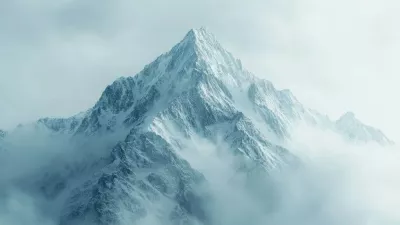 A towering mountain peak rises above the clouds, covered in snow and enveloped by morning mist.,Image: 950517957, License: Royalty-free, Restrictions:, Model Release: noFoto: Profimedia