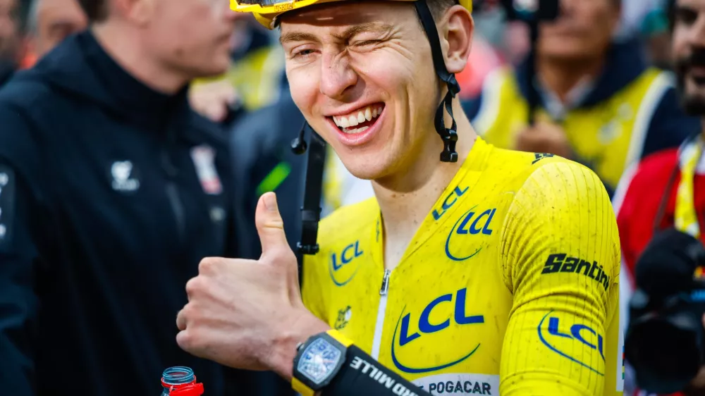 Zmagovalec dirke po Franciji Tadej Pogacar. / Foto: Anze Malovrh/sta