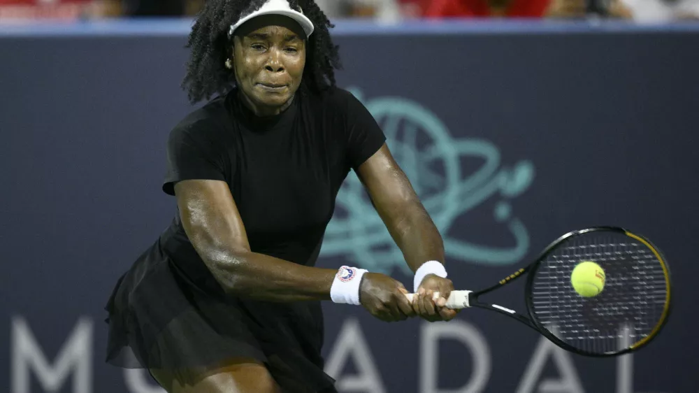 Venus Williams returns the ball against Magdalena Frech, of Poland, during a match at the Citi Open tennis tournament Thursday, July 24, 2025, in Washington. (AP Photo/Nick Wass)