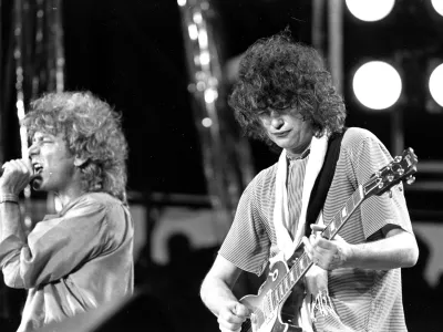 ﻿FILE - In this July 13, 1985 file photo, singer Robert Plant, left, and guitarist Jimmy Page of the British rock band Led Zeppelin perform at the Live Aid concert at Philadelphia's J.F.K. Stadium. Generations of aspiring guitarists have tried to copy the riff from Led Zeppelin's â€śStairway to Heaven.â€ť Starting Tuesday, June 14, 2016, a Los Angeles court will try to decide whether the members of Led Zeppelin themselves ripped off that riff. Page and Plant are named as defendants in the lawsuit brought by the trustee of late guitarist Randy Wolfe from the band Spirit. (AP Photo/Rusty Kennedy, File)
