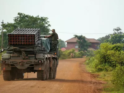 A Cambodian military personnel stands on a BM-21 Grad multiple rocket launcher, around 40 km (24 miles) from the disputed Ta Moan Thom temple, after Thailand and Cambodia exchanged heavy artillery on Friday as their worst fighting in more than a decade stretched for a second day, in Oddar Meanchey province, Cambodia, July 25, 2025. REUTERS/Soveit Yarn   TPX IMAGES OF THE DAY