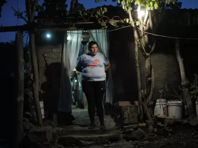 Sonia Coria, a Mexican migrant who fled cartel violence in her hometown with her family and sought refuge in Arizona, U.S., before voluntarily returning to Mexico, stands outside her home in Uruapan, Michoacan state, Mexico, July 18, 2025. REUTERS/Ivan Arias