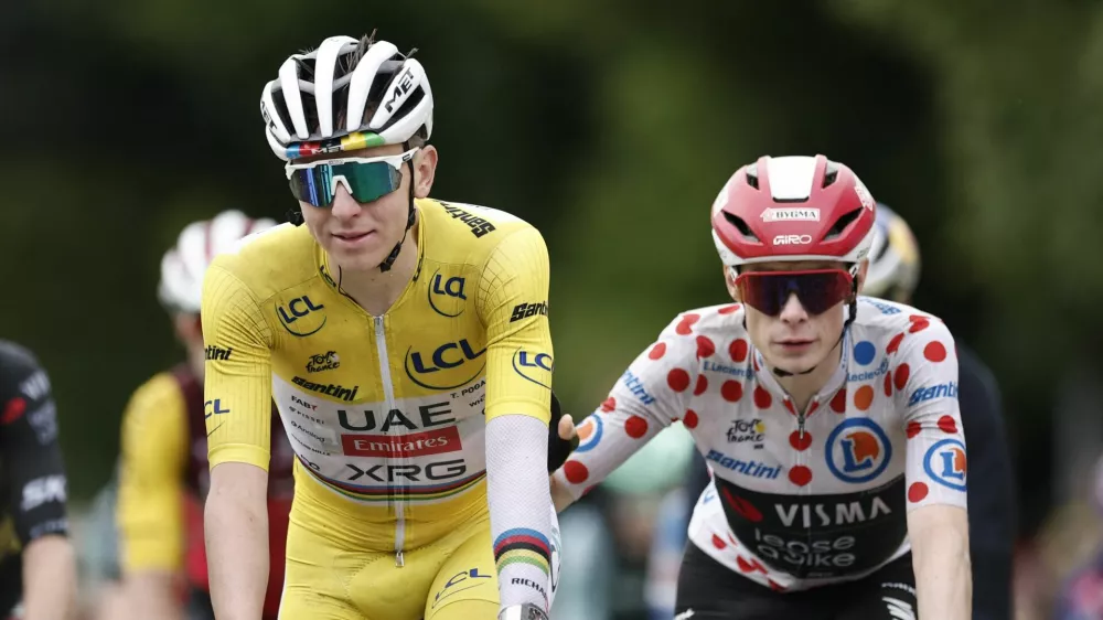 Cycling - Tour de France - Stage 20 - Nantua to Pontarlier - Pontarlier, France - July 26, 2025 UAE Team Emirates XRG's Tadej Pogacar and Team Visma | Lease a Bike's Jonas Vingegaard cross the finish line after stage 20 REUTERS/Benoit Tessier