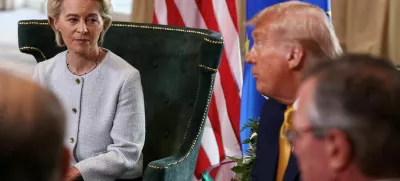 FILE PHOTO: European Commission President Ursula von der Leyen sits with U.S. President Donald Trump, after the announcement of a trade deal between the U.S. and EU, in Turnberry, Scotland, Britain, July 27, 2025. REUTERS/Evelyn Hockstein/File Photo