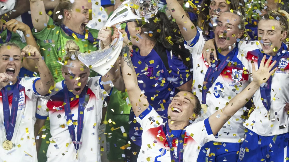 England's Lucy Bronze celebrates with the trophy after winning the Women's Euro 2025 final soccer match between England and Spain at St. Jakob-Park in Basel, Switzerland, Sunday, July 27, 2025. (Til Buergy/Keystone via AP)