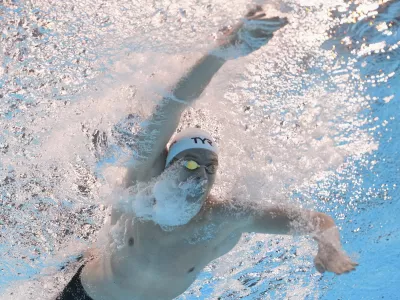 Leon Marchand of France competes in the men's 200-meter individual medley final at the World Aquatics Championships in Singapore, Thursday, July 31, 2025. (AP Photo/Lee Jin-man)