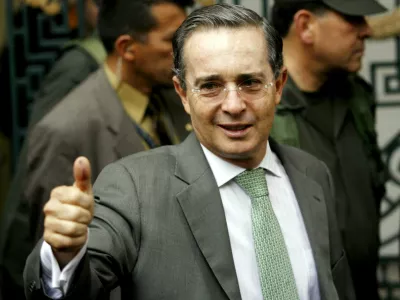 Colombian President Alvaro Uribe gestures after casting his vote during his country's presidential elections in Bogota May 28, 2006. Incumbent Uribe is favored to win in Sunday's Colombian presidential election because his security policies have cut crime and kidnapping associated with the country's 40-year insurgency. REUTERS/Jose Miguel Gomez