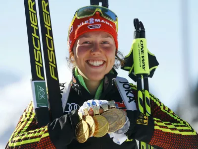 ﻿Biathlon - IBU World Championships - Women 12.5 km Mass Start - Hochfilzen, Austria - 19/2/17 - Laura Dahlmeier of Germany displays her medals.  REUTERS/Leonhard Foeger TPX IMAGES OF THE DAY