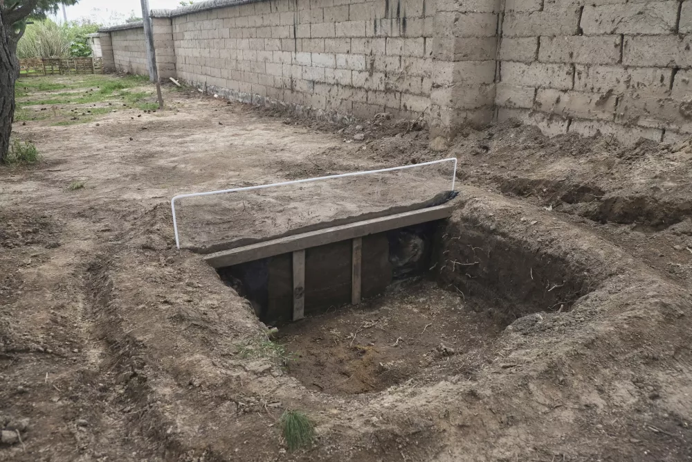 A view of a burial site of pig carcasses that are proxies for humans in research to help find people who have gone missing in Mexico during decades of drug cartel violence, in Zapopan, Mexico, Friday, July 11, 2025. (AP Photo/Alejandra Leyva)