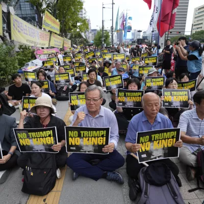South Korean protesters stage a rally against U.S. President Donald Trump's tariffs policy on South Korea, near the U.S. Embassy in Seoul, South Korea, Wednesday, July 30, 2025. (AP Photo/Ahn Young-joon)