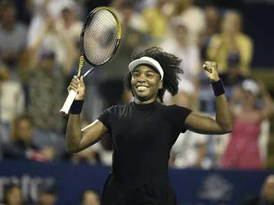 Venus Williams celebrates her win over Peyton Stearns during a match at the Citi Open tennis tournament Tuesday, July 22, 2025, in Washington. (AP Photo/Nick Wass)
