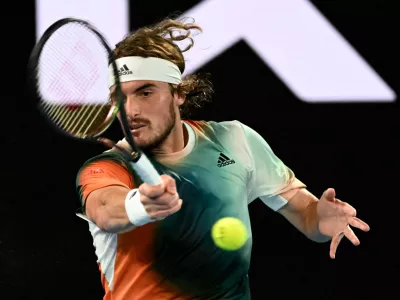 ﻿Tennis - Australian Open - Melbourne Park, Melbourne, Australia - January 26, 2022 Greece's Stefanos Tsitsipas in action during his quarter final match against Italy's Jannik Sinner REUTERS/Morgan Sette