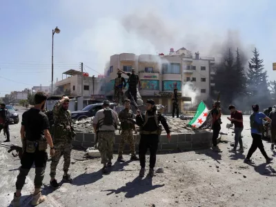Members of Syrian security forces stand together after Syrian troops entered the predominantly Druze city of Sweida on Tuesday following two days of clashes, in Sweida, Syria July 15, 2025. REUTERS/Karam al-Masri   TPX IMAGES OF THE DAY