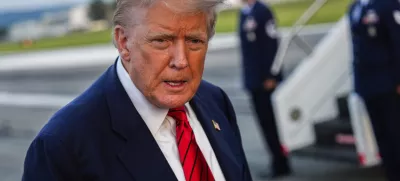 President Donald Trump speaks with reporters before boarding Air Force One at Lehigh Valley International Airport, Sunday, Aug. 3, 2025, in Allentown, Pa. (AP Photo/Julia Demaree Nikhinson)