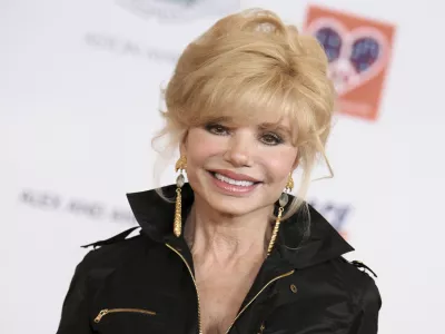 FILE - Loni Anderson arrives at the 22nd Annual Race To Erase MS Event held at the Hyatt Regency Century Plaza Hotel, Friday, April 24, 2015, in Los Angeles. (Photo by Richard Shotwell/Invision/AP, File)