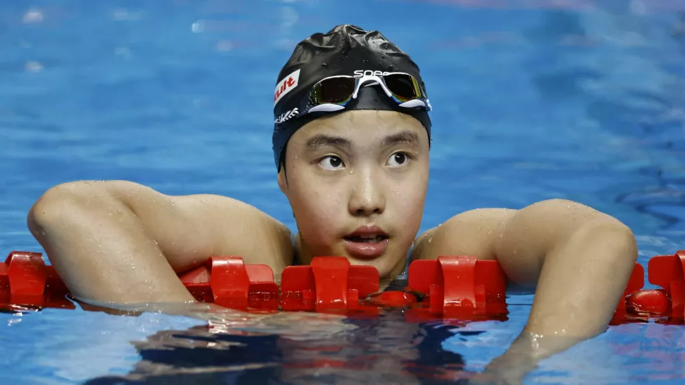 Swimming - World Aquatics Championships - Women 400m Medley - World Aquatics Championships Arena, Singapore - August 3, 2025 China's Zidi Yu reacts at the end of heat 2 REUTERS/Tingshu Wang
