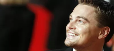 ** ALTERNATIVE CROP ** Actor Leonardo Di Caprio smiles as he arrives at Rome's Auditorium, Sunday, Oct. 15, 2006, to present the movie "The Departed," at the first ever edition of the Rome Film Festival. (AP Photo/Andrew Medichini)