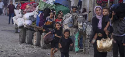 Displaced Palestinians flee Jabalia after the Israeli army issued evacuation orders in Gaza City, June 29, 2025. (AP Photo/Jehad Alshrafi)