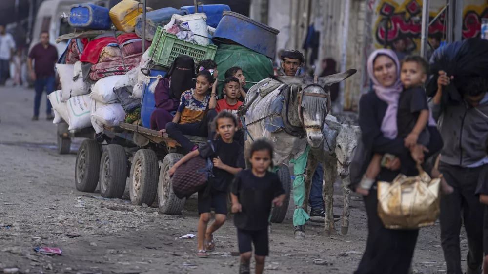 Displaced Palestinians flee Jabalia after the Israeli army issued evacuation orders in Gaza City, June 29, 2025. (AP Photo/Jehad Alshrafi)