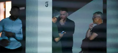 Brazil's former President Jair Bolsonaro talks to unidenfied people at his home after Brazil's Supreme Court put him under house arrest ahead of his trial for an alleged coup plot, in Brasilia, Brazil August 4, 2025. Pedro Ladeira/Folhapress via REUTERS ATTENTION EDITORS – THIS IMAGE HAS BEEN SUPPLIED BY A THIRD PARTY. NO RESALES. NO ARCHIVES. BRAZIL OUT. NO COMMERCIAL OR EDITORIAL SALES IN BRAZIL   TPX IMAGES OF THE DAY