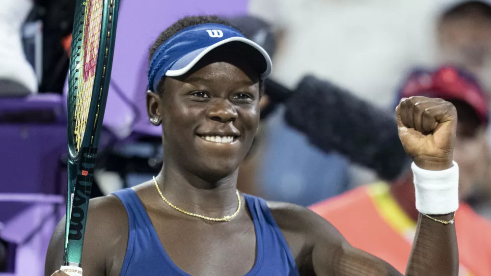 Victoria Mboko, of Canada, reacts after her win over Jessica Bouzas Maneiro, of Spain, during quarterfinal action at the National Bank Open women's tennis tournament in Montreal, Monday, Aug. 4, 2025. (Christinne Muschi/The Canadian Press via AP)