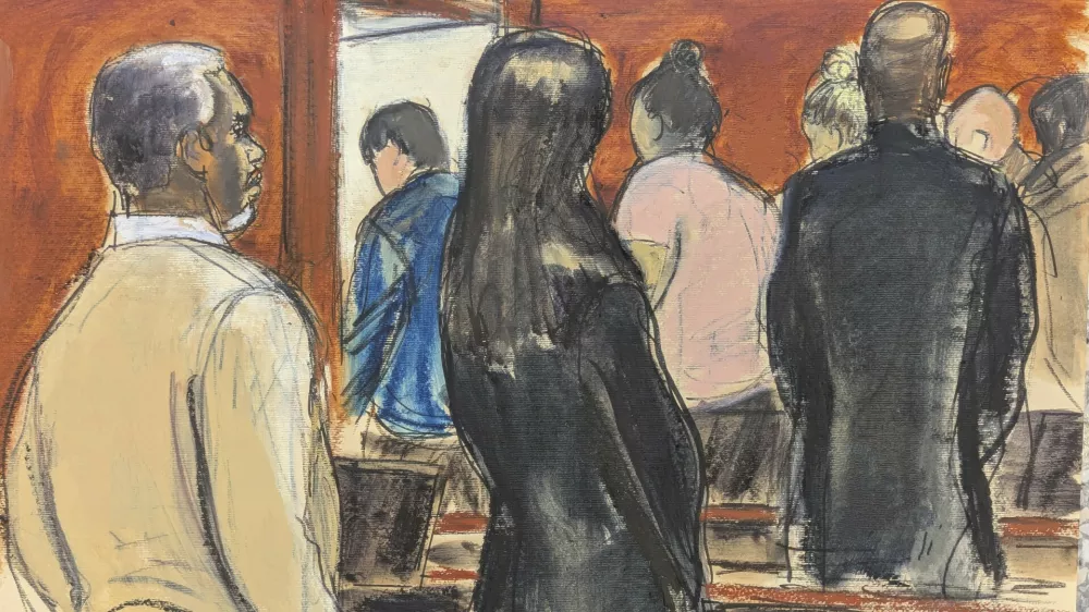 Sean 'Diddy' Combs, left, stands with his defense team, as he watches the jury file out after Judge Arun Subramanian instructed the jury to continue deliberations in Manhattan federal court, Tuesday, July 1, 2025, in New York. (Elizabeth Williams via AP)