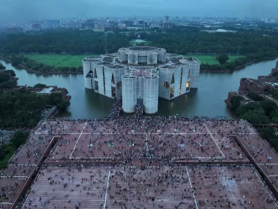 FILE- Protesters celebrate at the Parliament House premise after news of Prime Minister Sheikh Hasina's resignation, in Dhaka, Bangladesh, Aug. 5, 2024. (AP Photo/Fatima Tuj Johora, File)